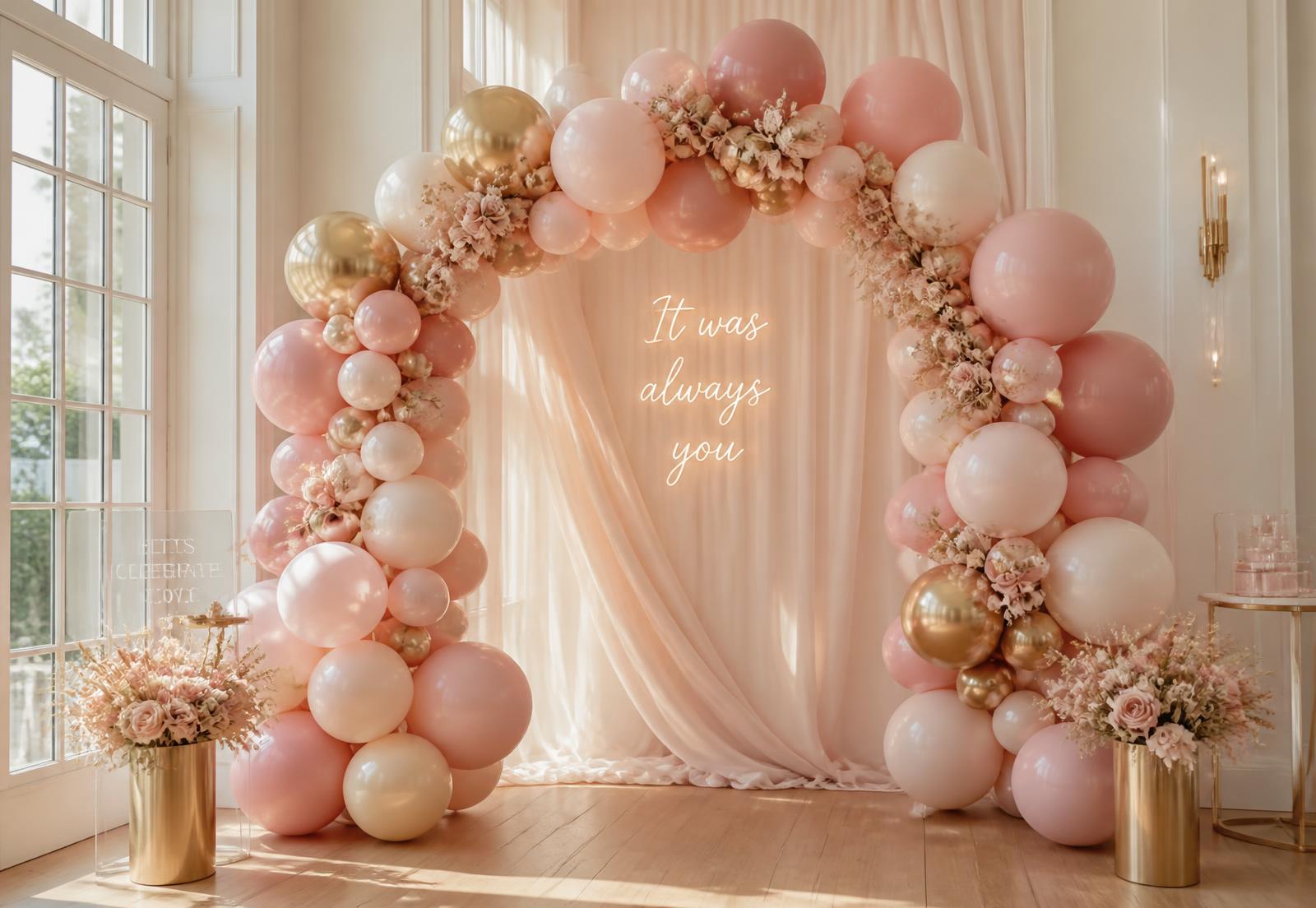 Blush, ivory, and gold balloon arch styled for a celebration in Muskegon, Michigan